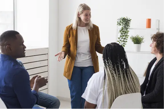 Registered Behavior Technician standing in front of a group of people